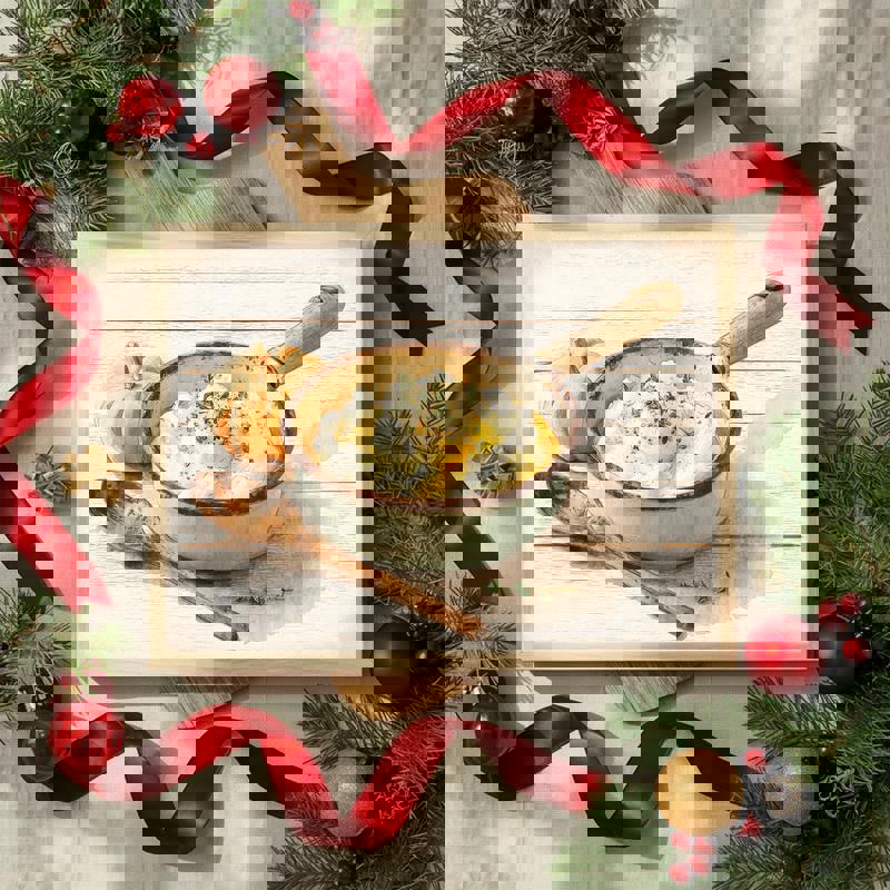 Vintage enamel bowl with mashed potatoes canvas, speckled enamelware and wooden spoon, overhead angle, earthy fall hues