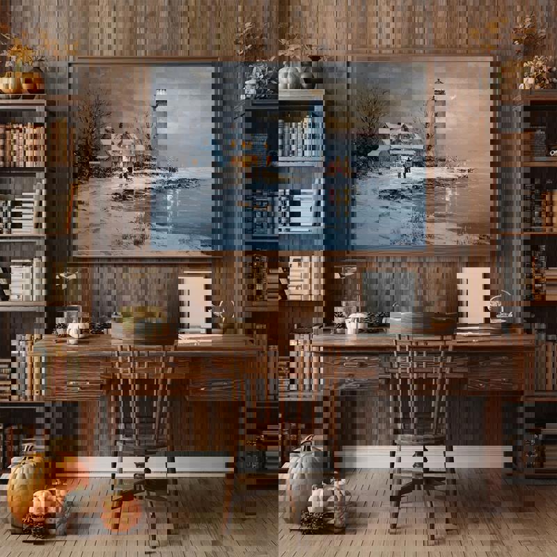 Nautical holiday canvas wall art with a lighthouse, gentle surf and snowfall, seasonal decor for a coastal home office