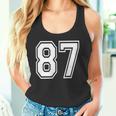 87番の前面と背面にホワイトのプリント。 タンクトップ