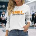 Smile It Makes People Wonder What You're Up To 長袖Tシャツ 彼女への贈り物