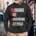 モロンはアメリカを支配している政治的ユーモアの自由のスピーチ 長袖Tシャツ 高齢者への贈り物