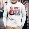 面白いクリスマスグレートアゲイントランプサンタファンusaホリデー 2024 長袖Tシャツ 高齢者への贈り物
