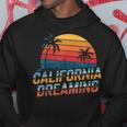 カリフォルニア ドリーミング サンセット ヤシの木 街並み パーカー 面白い贈り物
