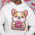 かわいいコーギーのドーナツを持つ漫画の犬愛好家アートキッズ。 パーカー 面白い贈り物