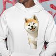 かわいい日本の秋田犬が角をのぞく犬好き。 パーカー 面白い贈り物