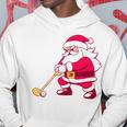 ゴルフをする面白い醜いクリスマスサンタ。 パーカー 面白い贈り物