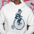 ビンテージのペニーファージング自転車に乗る粋なカエルのサイクリスト パーカー 面白い贈り物