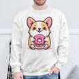 かわいいコーギーのドーナツを持つ漫画の犬愛好家アートキッズ。 スウェットシャツ 高齢者への贈り物