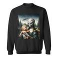 エイリアンホールディングヒューマンベイビーufo地球外接触tシャツ スウェットシャツ