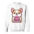 かわいいコーギーのドーナツを持つ漫画の犬愛好家アートキッズ。 スウェットシャツ