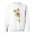 かわいい日本の秋田犬が角をのぞく犬好き。 スウェットシャツ