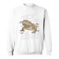 ひげを生やしたドラゴン、バルタゲーム、フトアゴヒゲトカゲ、ポゴナとくつろぐ 長袖tシャツ スウェットシャツ
