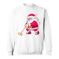 ゴルフをする面白い醜いクリスマスサンタ。 スウェットシャツ
