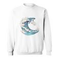 海の波から現れる芸術的なクジラ スウェットシャツ
