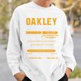 Oakleyオークリー 完全訳不明なネームシャツ フロントプリント 1Kana 長袖tシャツ スウェットシャツ 彼への贈り物