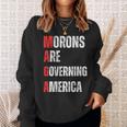 モロンはアメリカを支配している政治的ユーモアの自由のスピーチ スウェットシャツ 彼女への贈り物