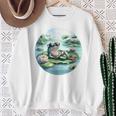 「池でリラックス」 – スイレンの上にサングラスをかけたカエル スウェットシャツ 年配の女性への贈り物