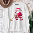 ゴルフをする面白い醜いクリスマスサンタ。 スウェットシャツ 年配の女性への贈り物
