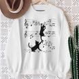 楽譜で遊ぶ面白い猫 スウェットシャツ 年配の女性への贈り物