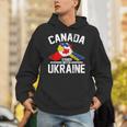 カナダはウクライナのウクライナのカナダの旗のtシャツで立ちます パーカー