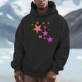 カラフルなオレンジピンクの星、流れ星柄デザイン。 Hoodie