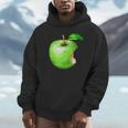 噛まれた青リンゴのイラスト パーカー