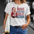 面白いクリスマスグレートアゲイントランプサンタファンusaホリデー 2024 Tシャツ 彼女への贈り物