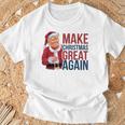 面白いクリスマスグレートアゲイントランプサンタファンusaホリデー 2024 Tシャツ 高齢者への贈り物